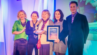Animal carer collects award for dedicating her life