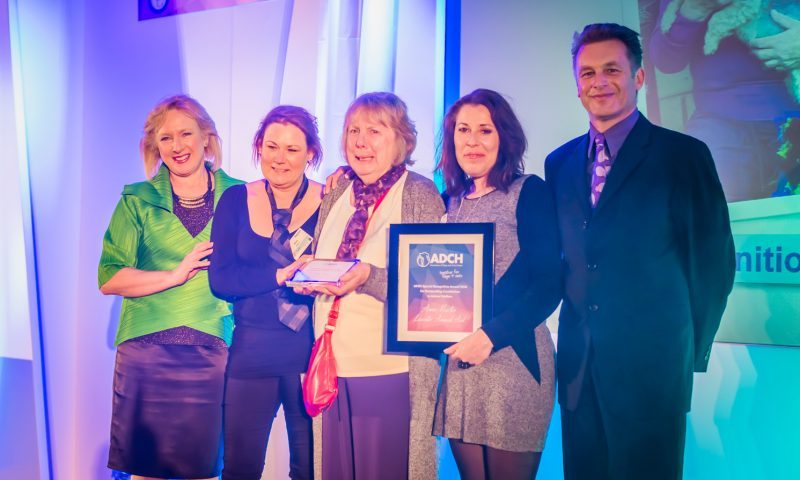 Animal carer collects award for dedicating her life