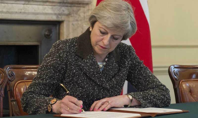Theresa May signs letter to formally begin Brexit process